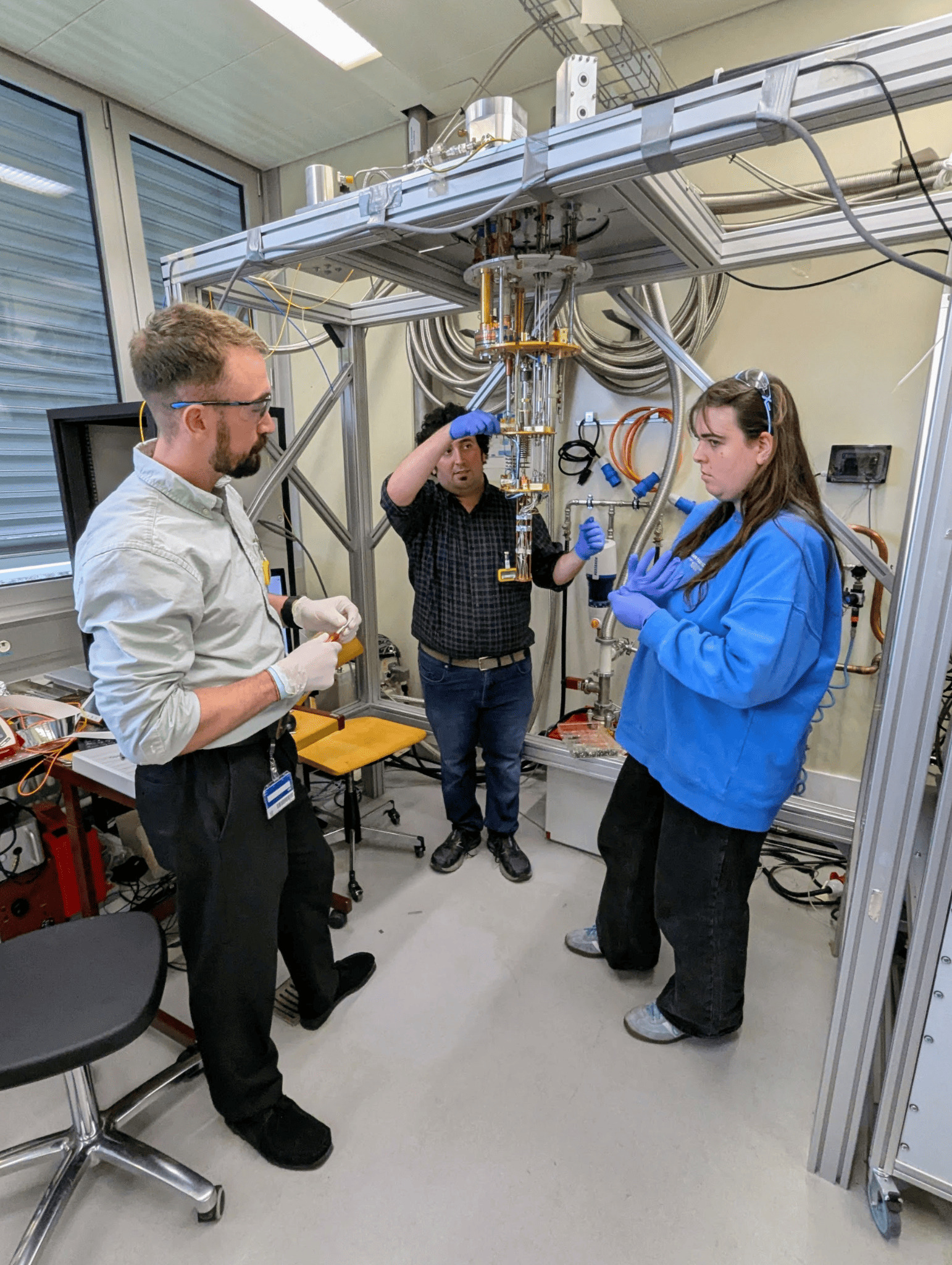 Group members working with quantum sensors on a dilution fridge